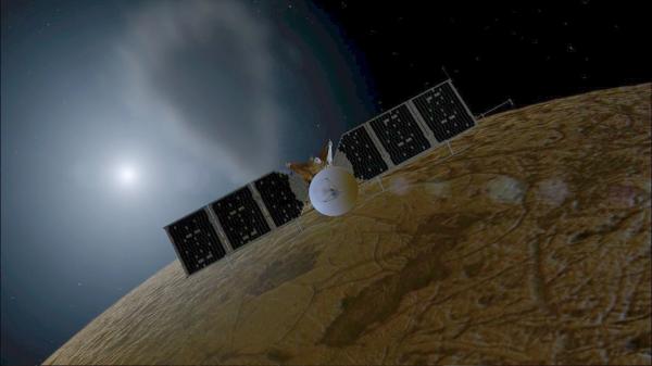 A probe in space with Europa in the background.